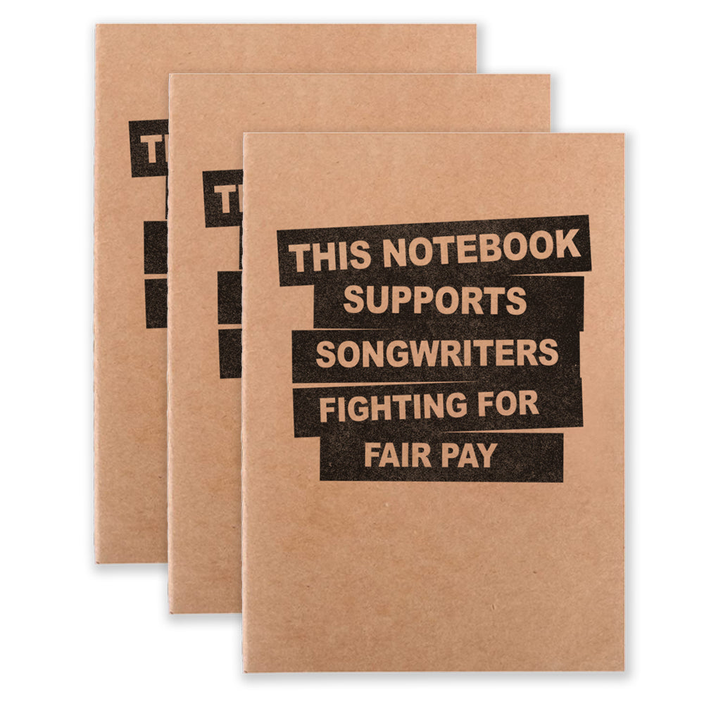 Three notebooks that say "This Notebook Supports Songwriters Fighting For Equal Pay" on the front
