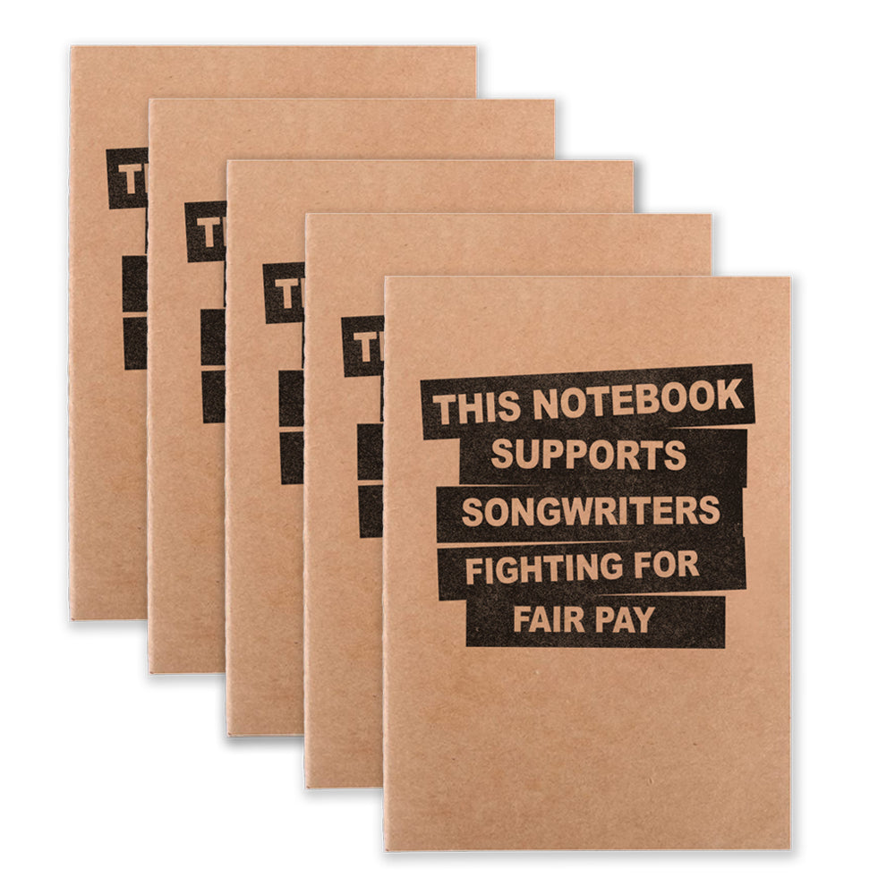 Five notebooks that say "This Notebook Supports Songwriters Fighting For Equal Pay" on the front