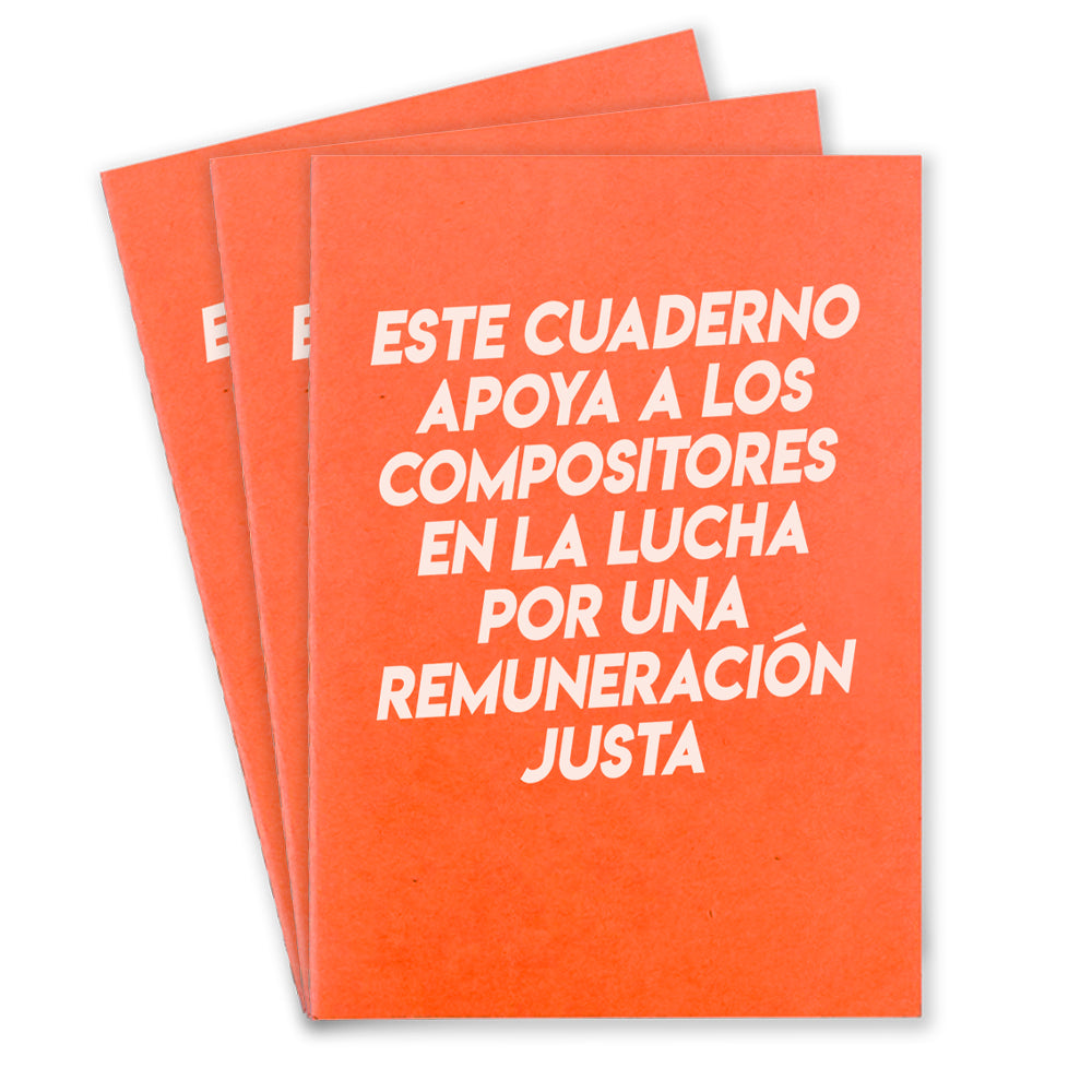 Three orange notebooks that says "Este Cuaderno Apoya A Los Compistores En La Lucha Por Una Remuneracion Justa" on the front