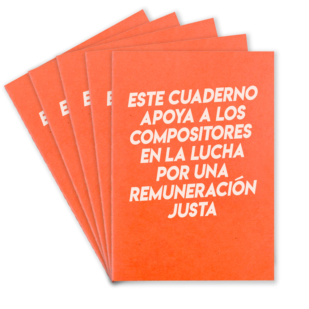 Five orange notebooks that says "Este Cuaderno Apoya A Los Compistores En La Lucha Por Una Remuneracion Justa" on the front