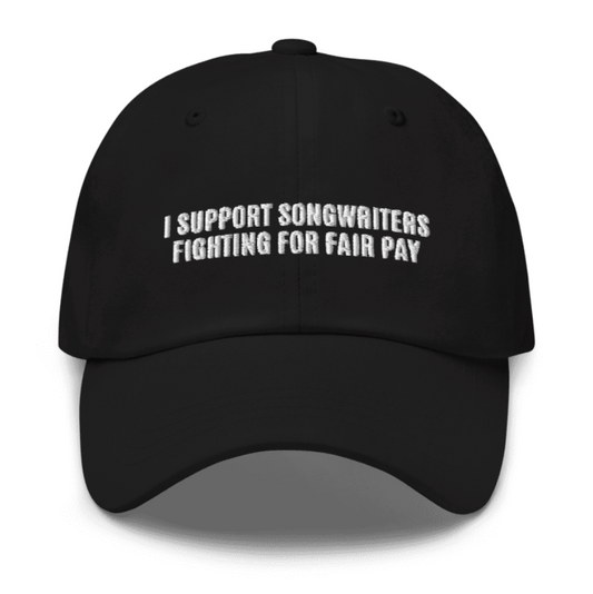 A black hat with white text that says "I support songwriters fighting for fair pay"
