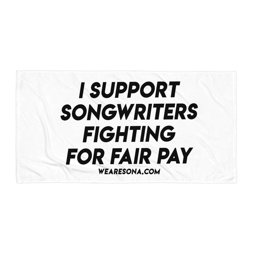 White towel that says "I Support Songwriters Fighting For Fair Pay" in black text