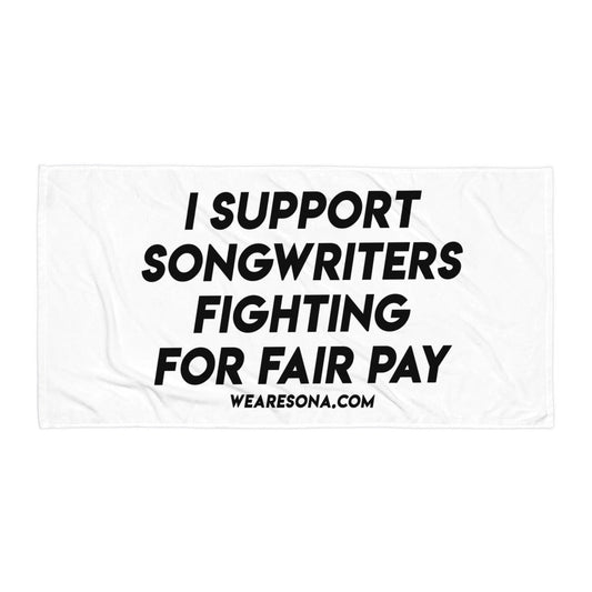 White towel that says "I Support Songwriters Fighting For Fair Pay" in black text